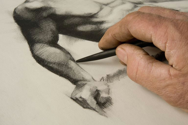 artist s hand and sketch