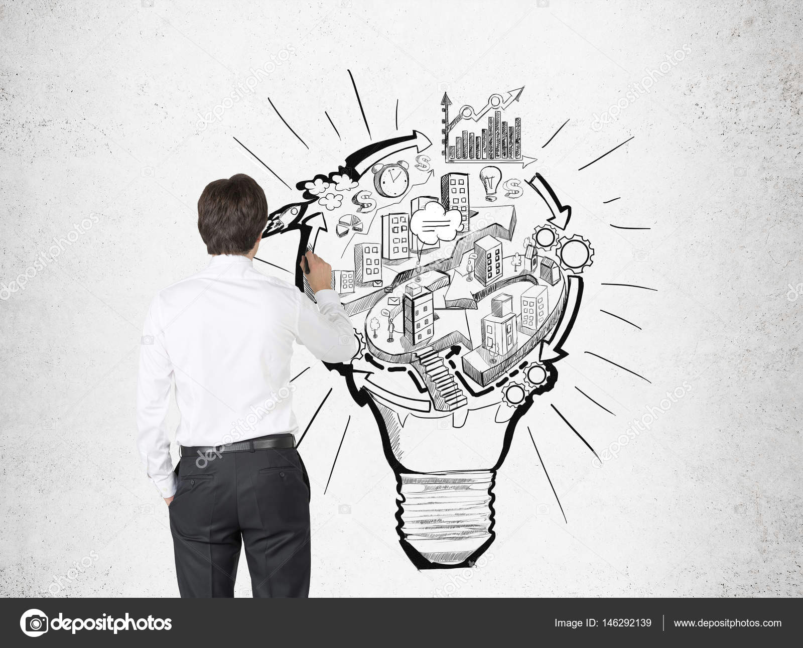 businessman drawing a light bulb city stock photo