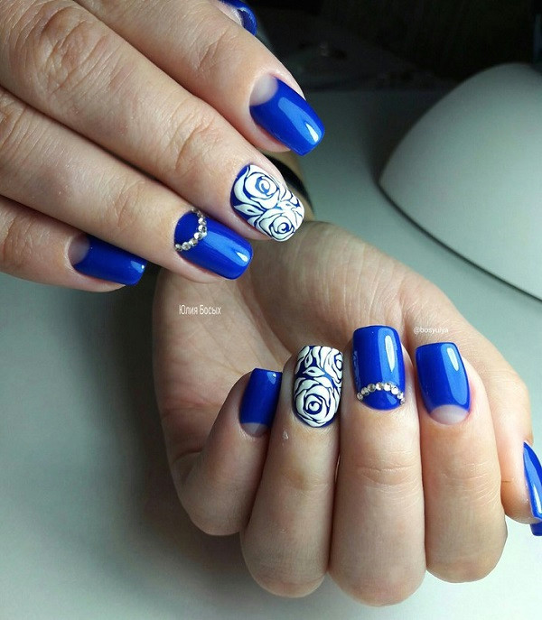 white roses on royal blue polish jpg