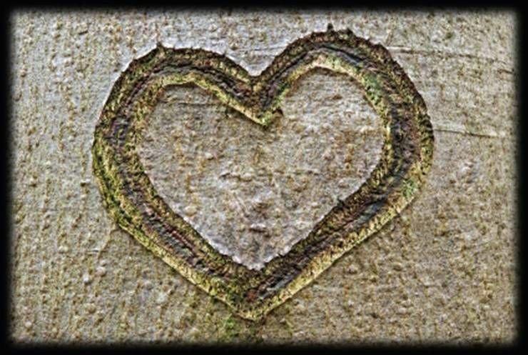 concrete filler with a finger drawn heart shape it reminds me of being a little girl and drawing in the mud or wet sand with a stick