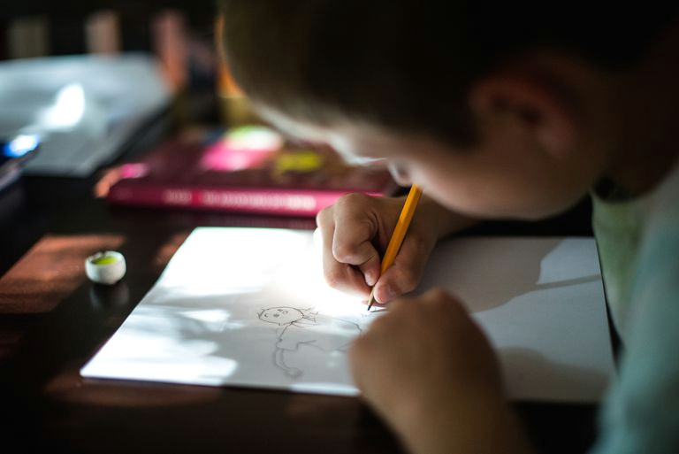 boy drawing cartoon person