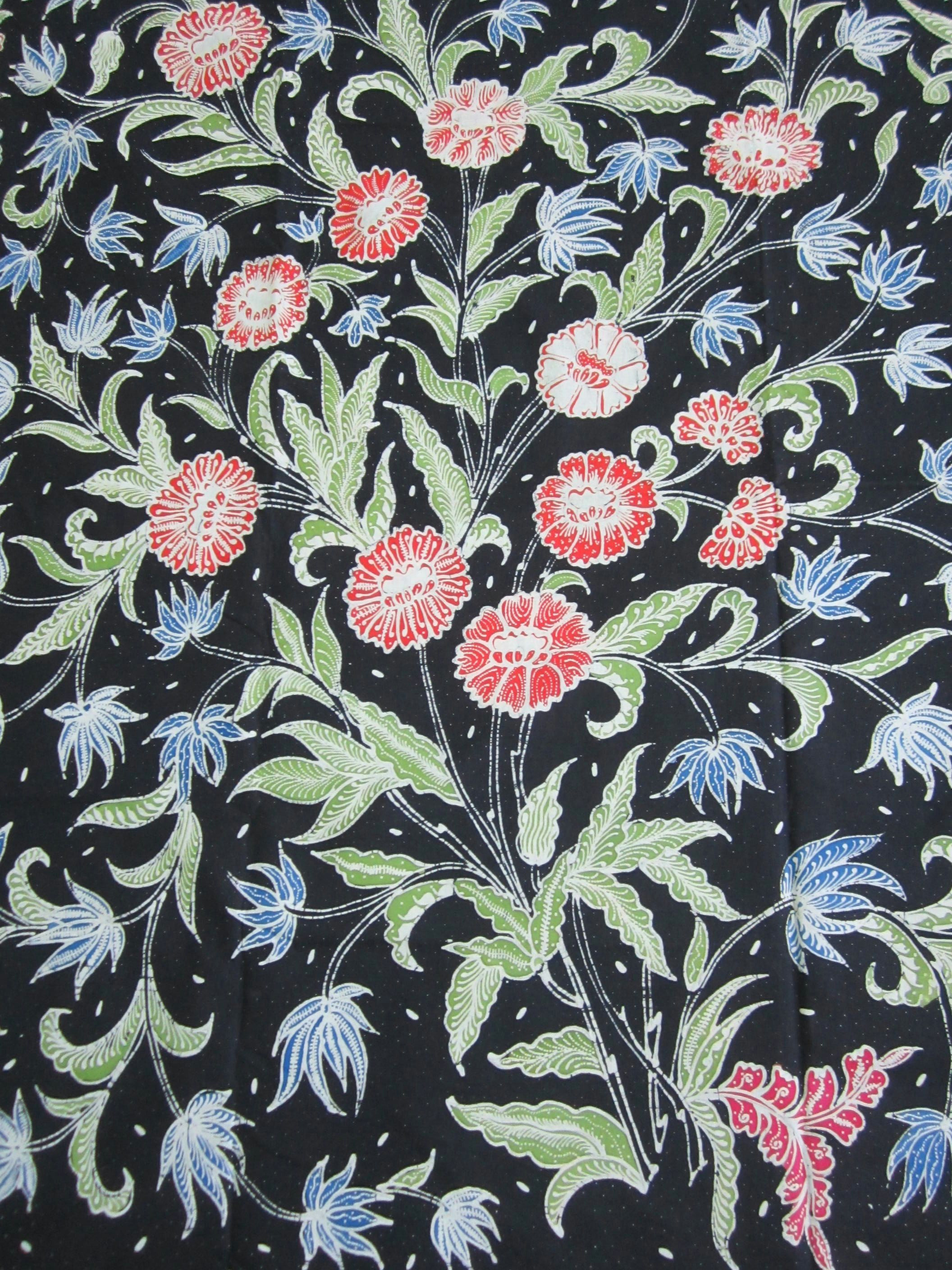 floral tulis batik on navy blue background from java indonesia