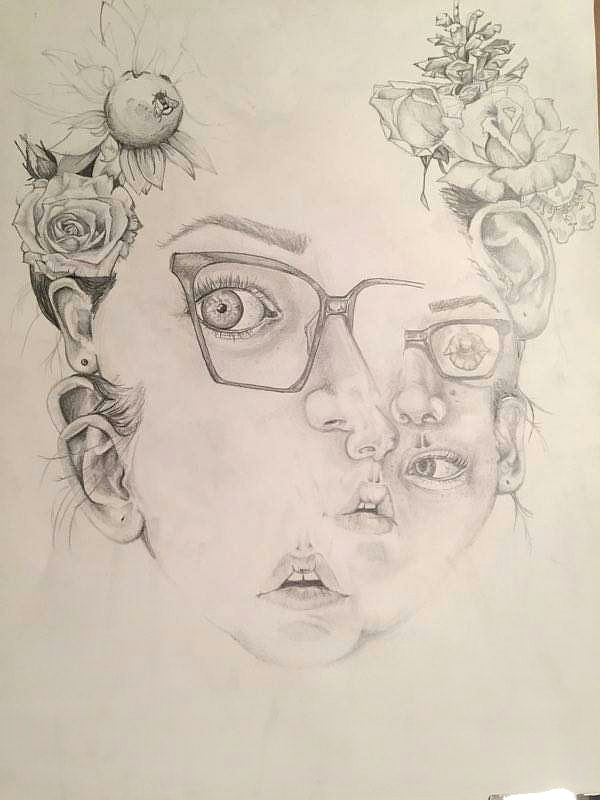 the project was to create an abstract self portrait using observation to draw the features she also collaged various flowers into the drawing for a