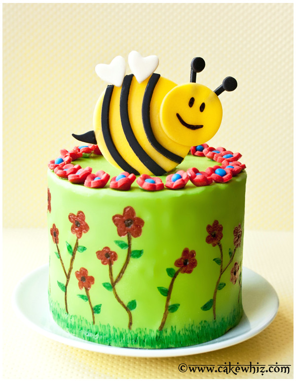 use this tutorial to make a beautiful spring cake with fondant flowers and bumble bee also learn how to draw on a cake with edible markers