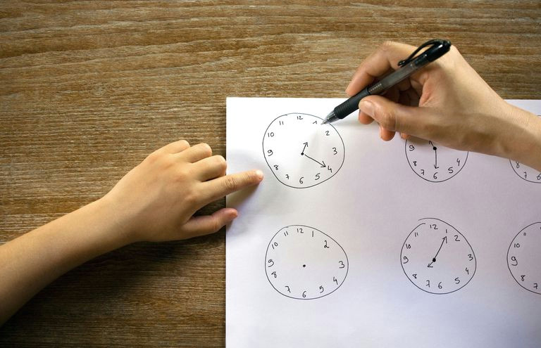 young girl learning to read the time