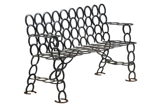 unique iron bench made from actual vintage horse shoes