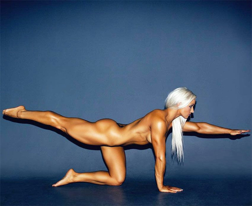jade mead performing yoga while naked displaying her muscular development and tone kama fitness