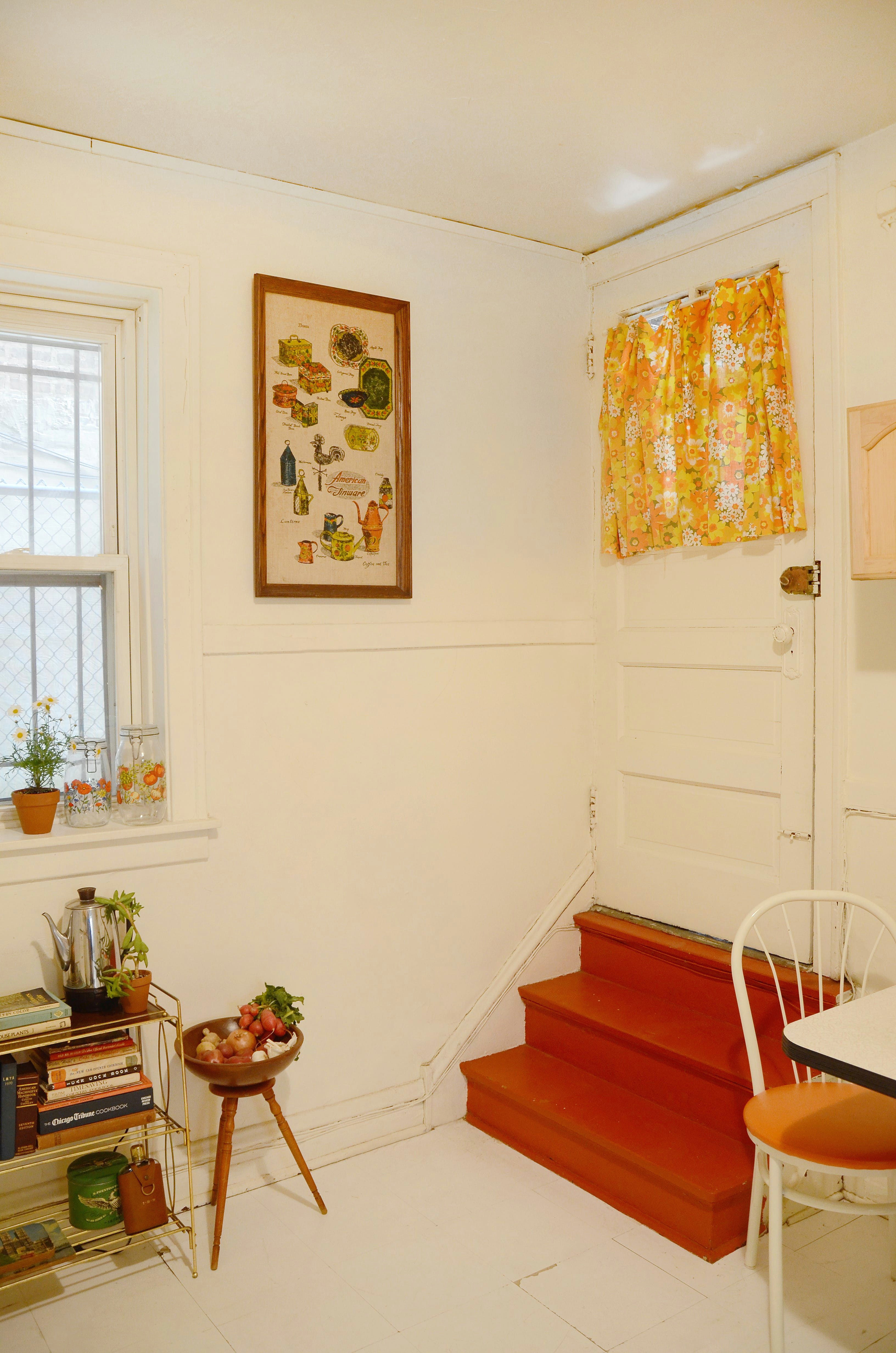 the curtains in the kitchen were made from fabric courtney found at an estate sale