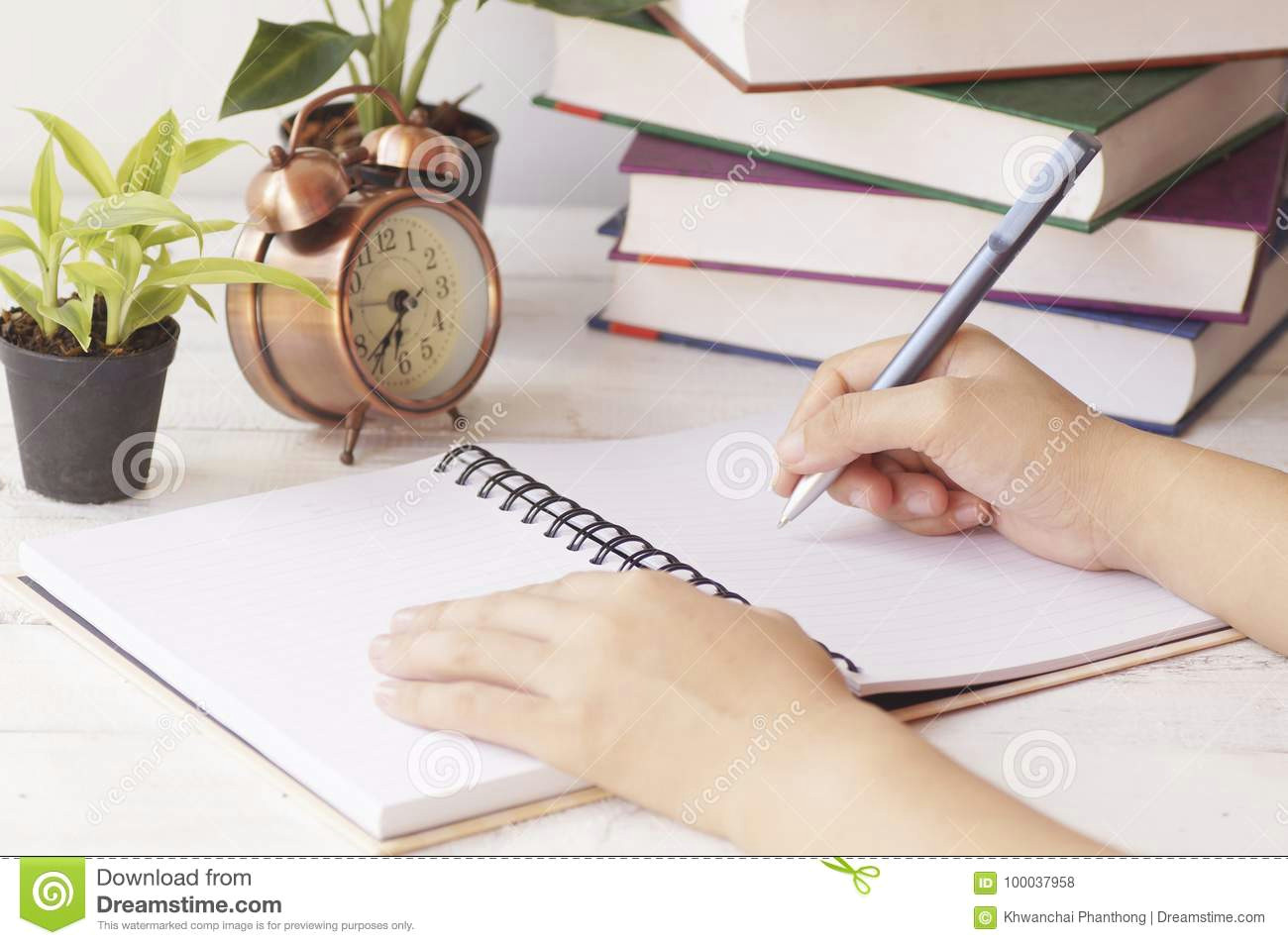 hand writing on notebook on table