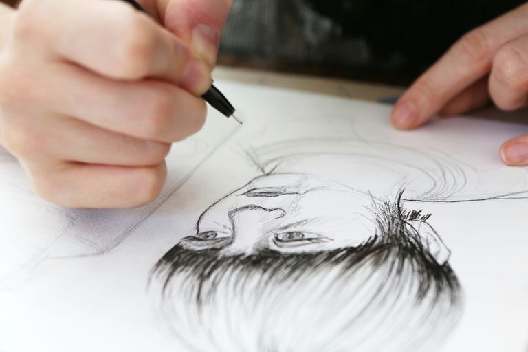 an illustrator working on a drawing