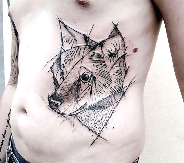 a cute tattoo of a little wolf inked on the guy s stomach in sketch style