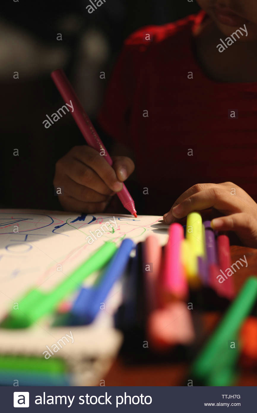 girl drawing with colored pencil on a drawing board ttjh7g jpg