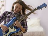 Drawing Of A Girl Playing Guitar Best First songs to Learn On Electric Guitar